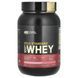 Whey protein isolate Optimum Nutrition (100% Whey Gold Standard) 909 g with strawberry flavor.