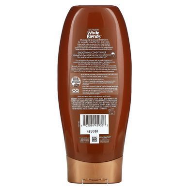 Розгладжувальний кондиционер Garnier (Whole Blends Smoothing Conditioner) 370 мл с маслом кокоса и маслом какао купить в Киеве и Украине